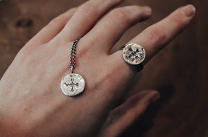 matching silver compass necklace and ring