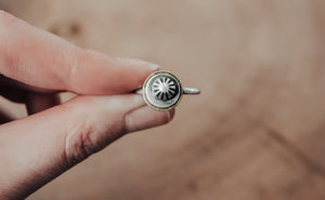 silver and brass conical ring