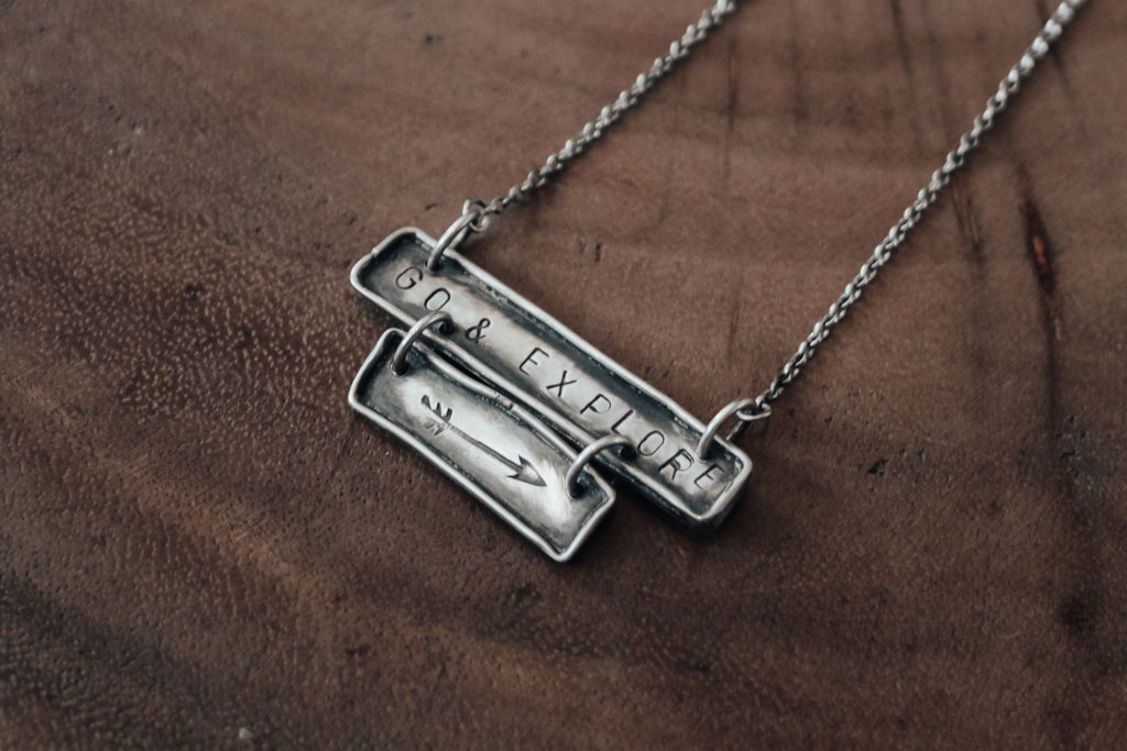 Hand stamped Go and explore arrow necklace