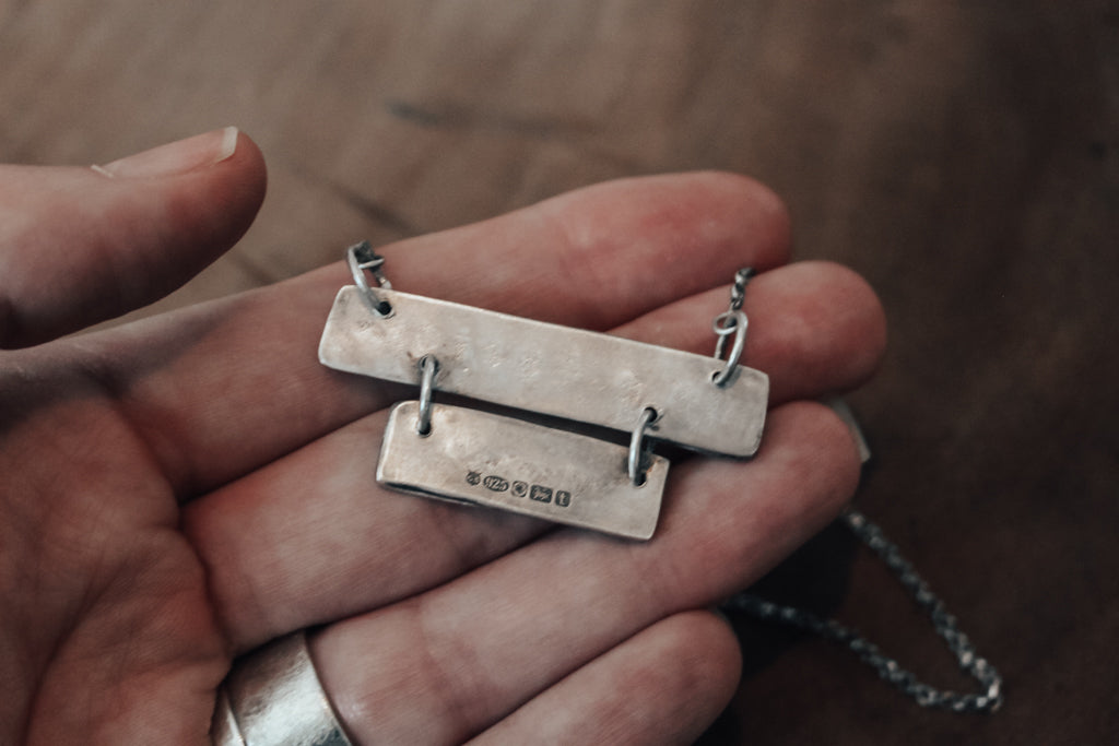 underside of silver necklace with hallmarks