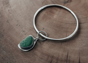 heavy weight silver bangle with green sea glass charm