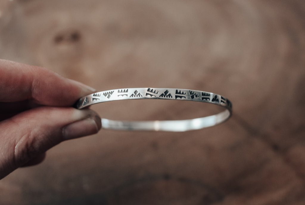 Hand stamped pattern silver bangle