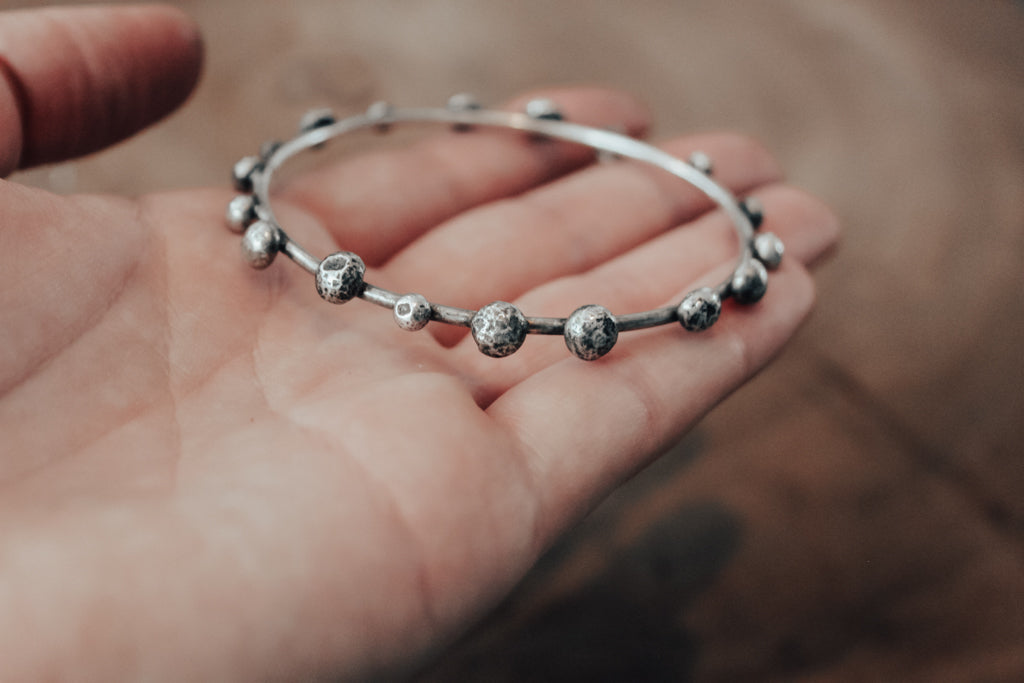 Textured silver pebbles on bangle